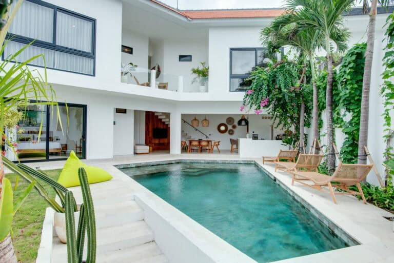 Modern villa with pool and lush greenery