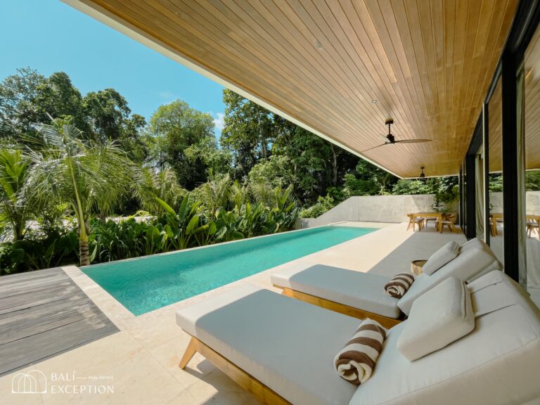 Luxurious outdoor pool with modern patio furniture.