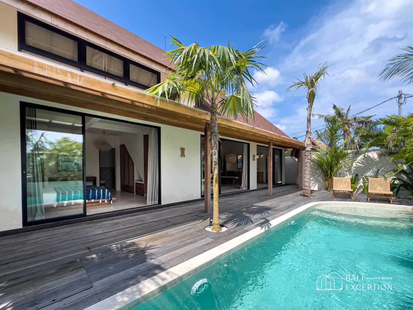 Modern villa with pool and palm trees