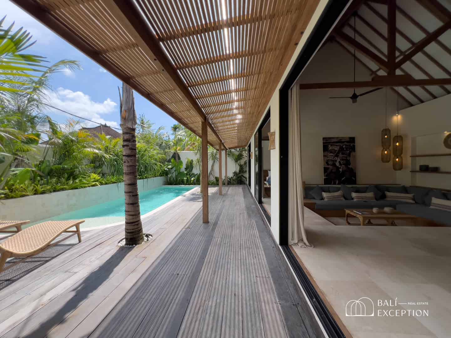 Luxurious villa with pool and lounge area.