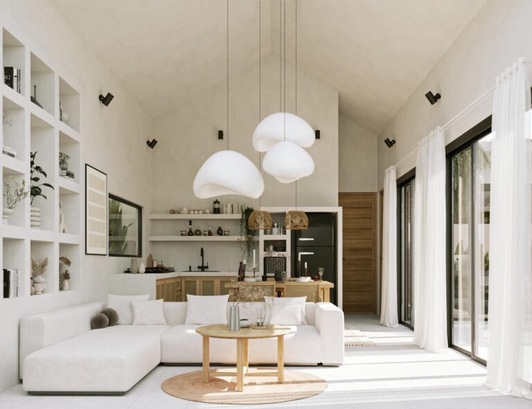 Minimalist living room with large windows and white decor.