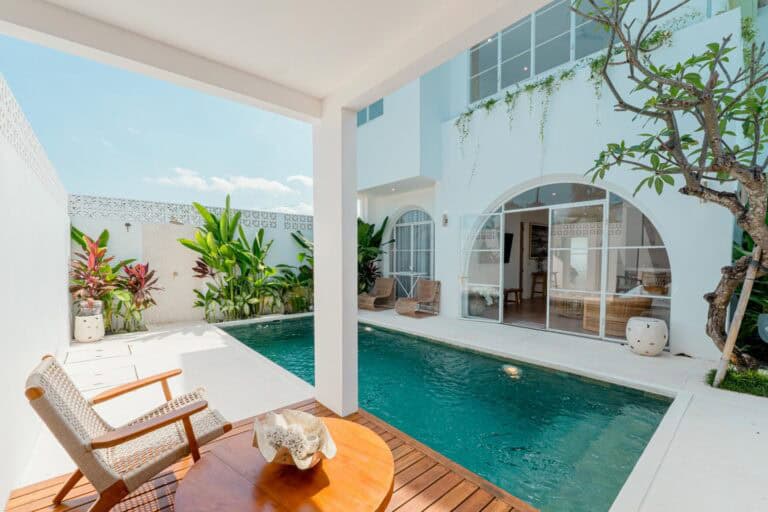 Modern patio with pool and tropical plants