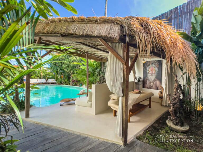 Tropical poolside cabana with lush greenery