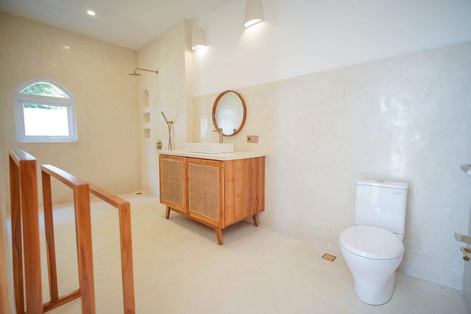 Modern minimalist bathroom with wooden vanity and shower.