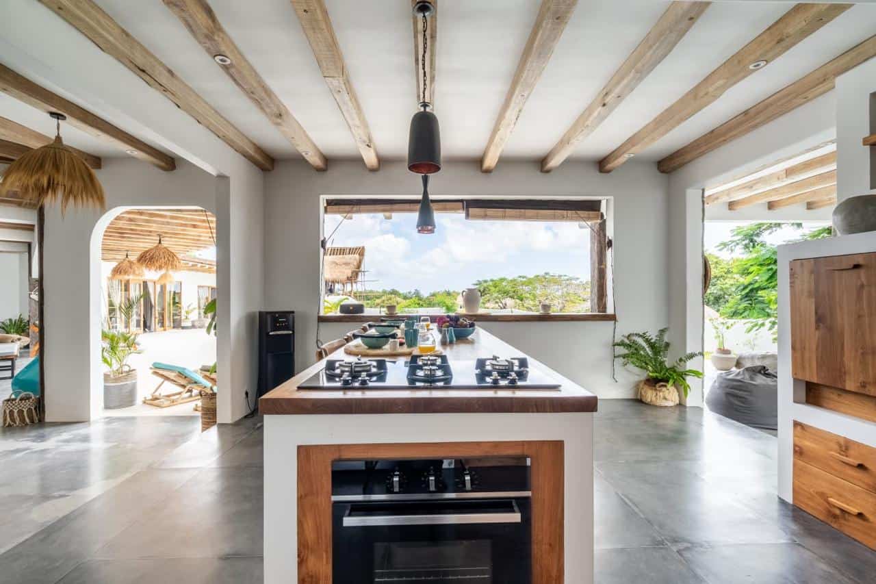 Modern kitchen with wooden beams and large window