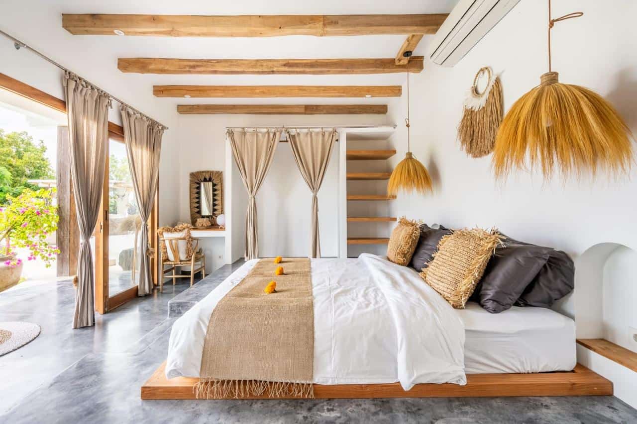 Cozy bedroom with natural decor and sunlight.
