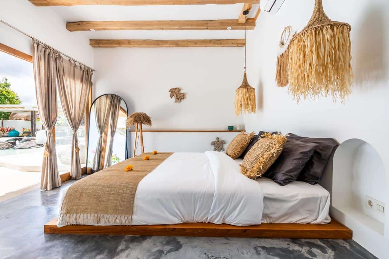 Cozy bedroom with rustic decor and natural light.