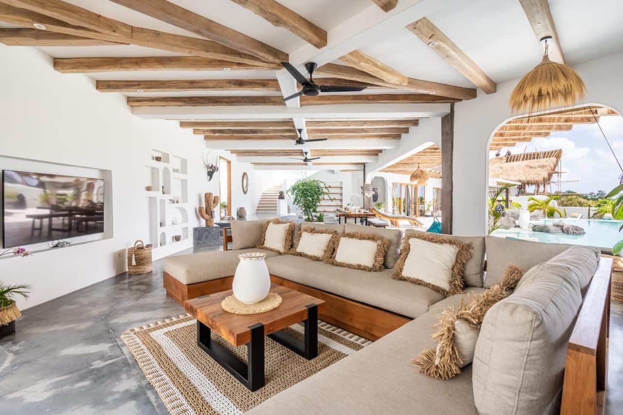 Spacious living room with poolside view