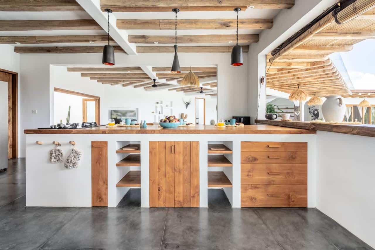 Modern kitchen with wood accents and open shelving.
