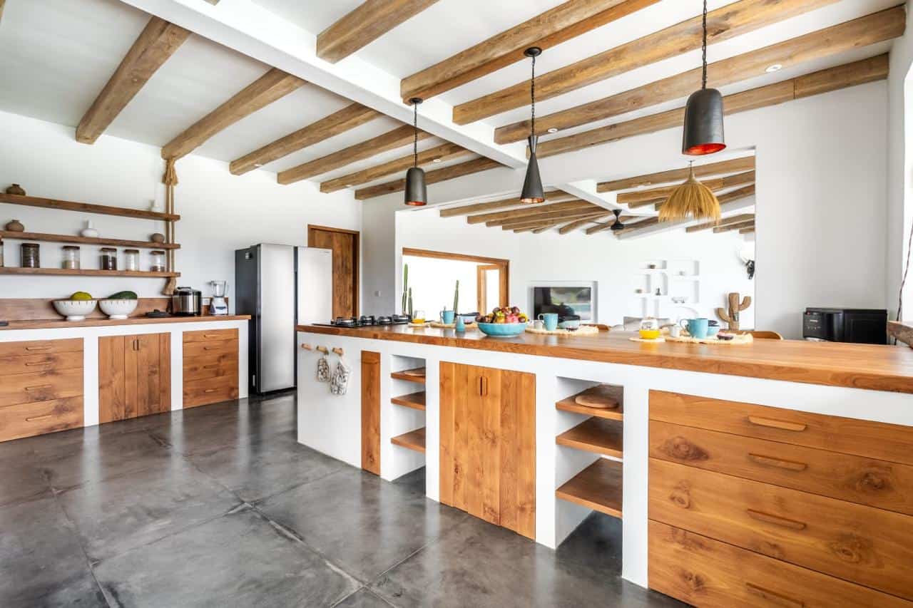 Modern kitchen with wooden accents and open shelves.