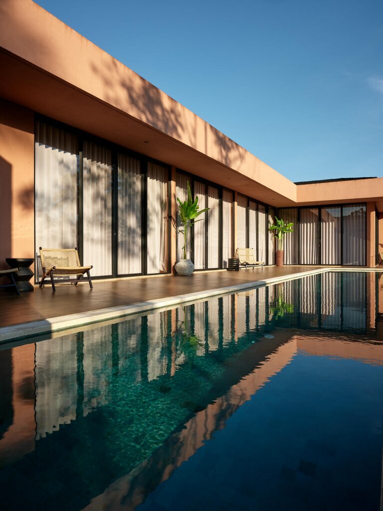 Modern house with large pool and patio.