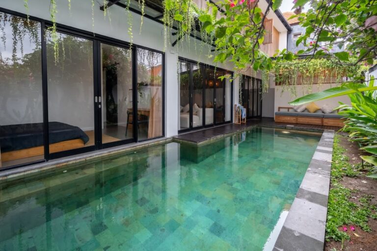 Modern villa with private pool and lush greenery