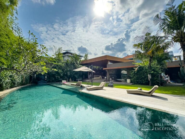 Luxurious villa with pool and lounge chairs