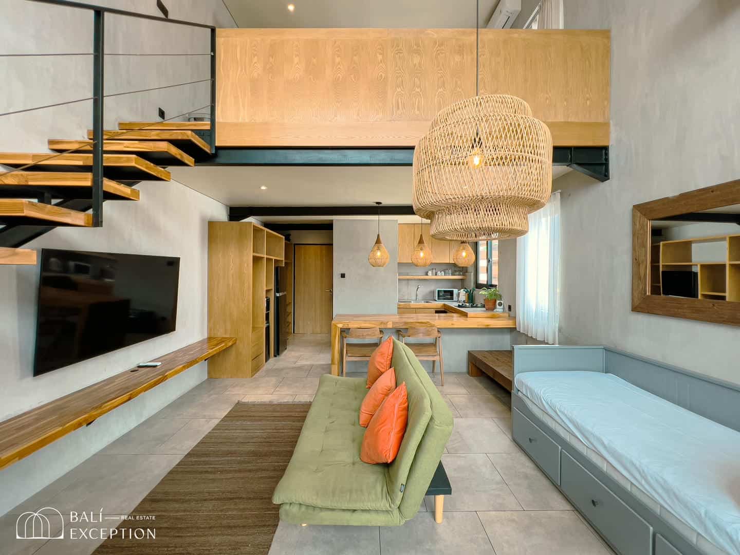Modern loft interior with wooden staircase and furniture.