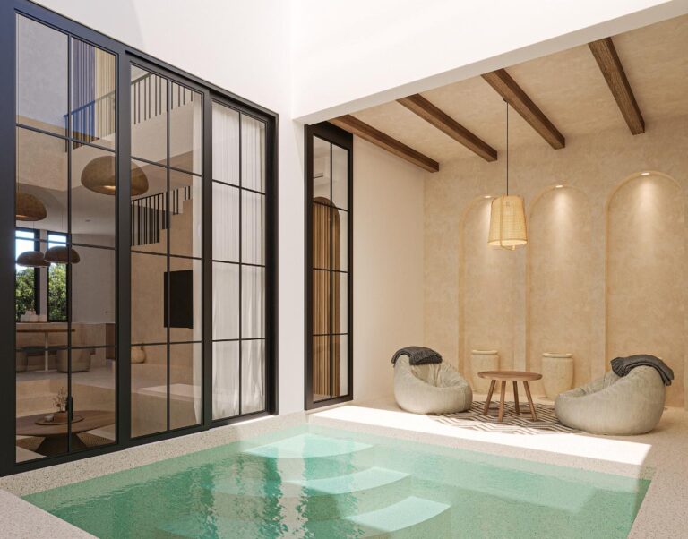 Modern indoor pool with seating area and stairs.