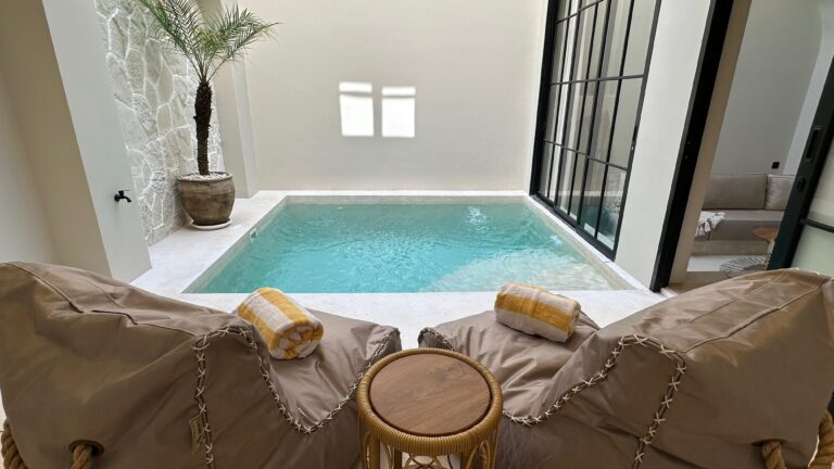 Indoor pool with cozy lounge chairs.