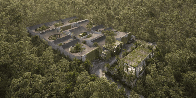 Aerial view of modern buildings surrounded by trees.