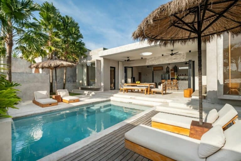 Luxury villa with pool and outdoor seating area.