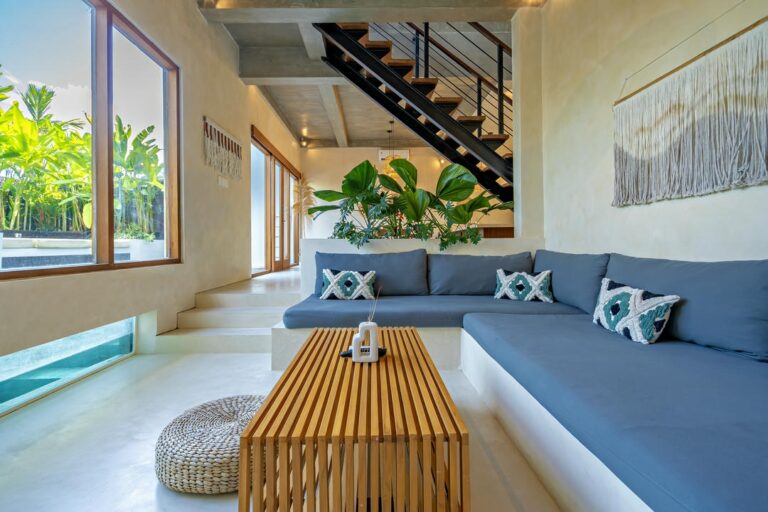 Modern living room with staircase and plants