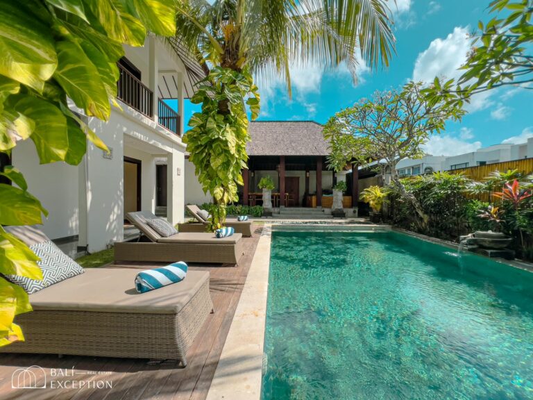 Luxury villa with pool and lush garden.