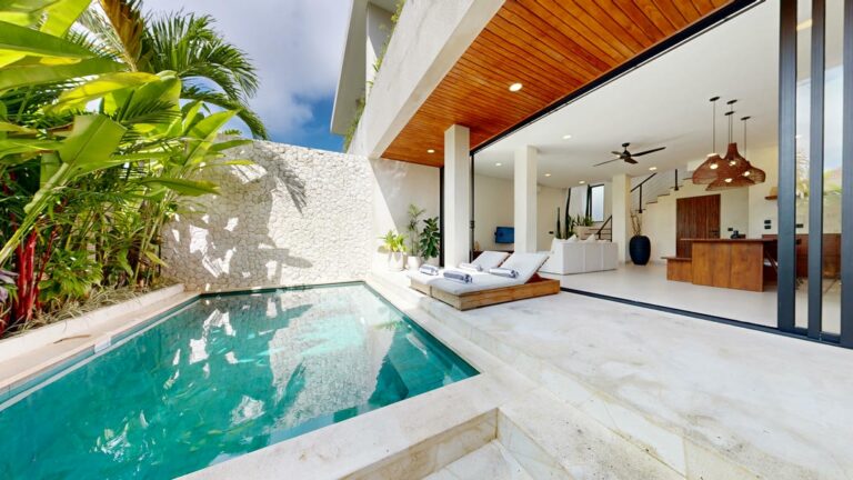 Luxury villa with pool and open living area.