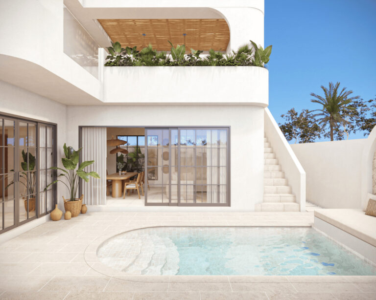 Modern villa with pool and outdoor seating.