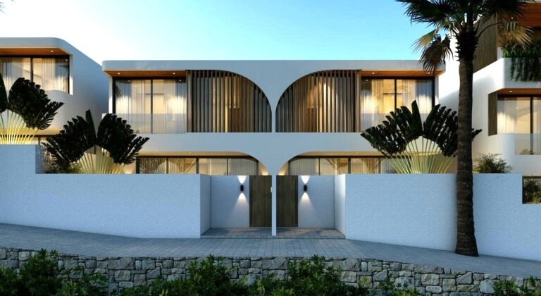 Modern house with large windows and palm trees