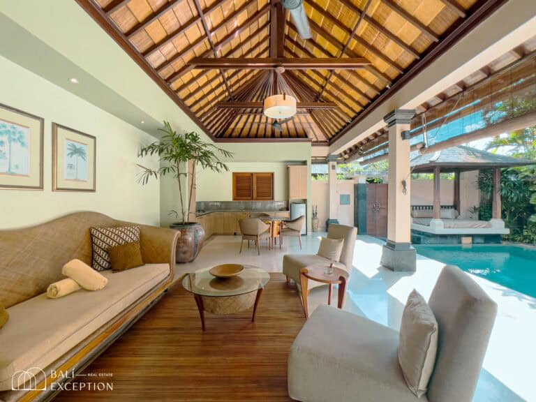 Luxurious villa with open living area and pool.