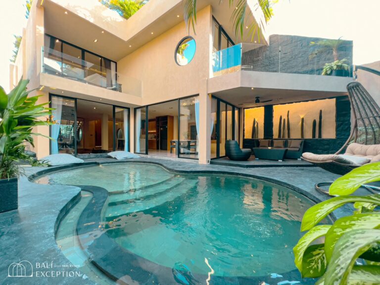 Modern villa with pool and patio furniture.
