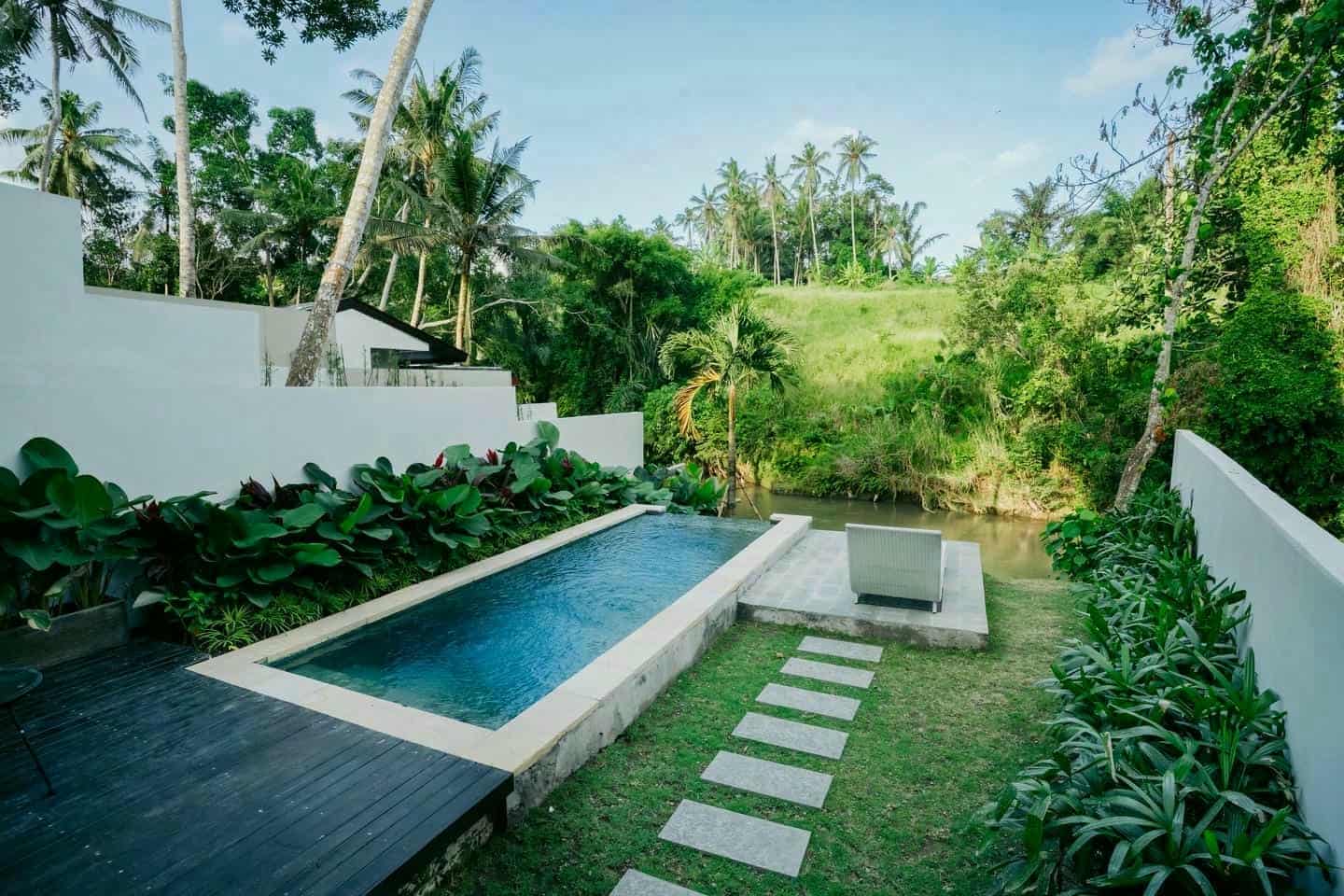 Tropical villa with pool and garden view.