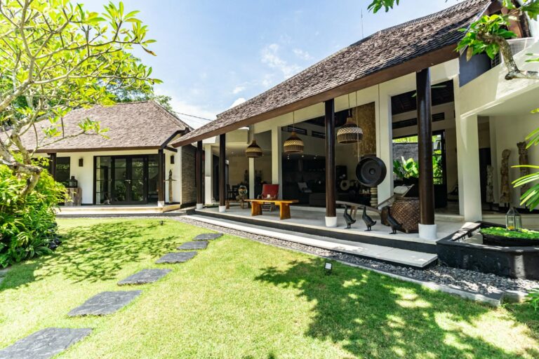 Modern outdoor living space with lush garden.