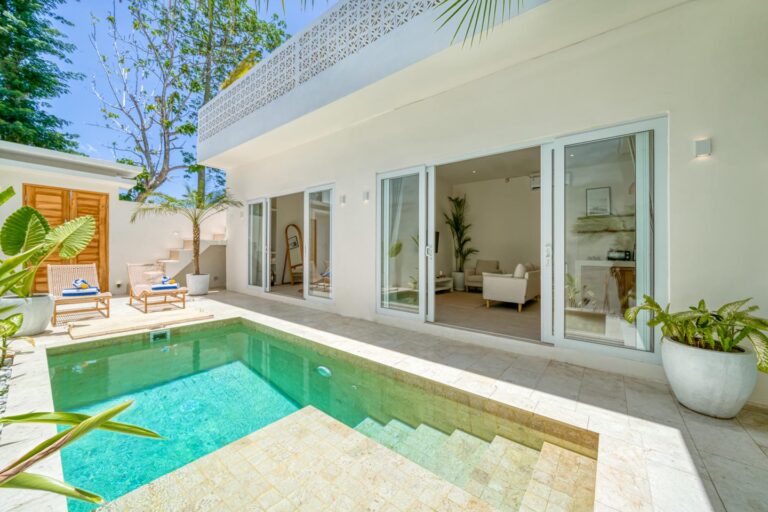 Luxurious modern villa with private pool and patio.