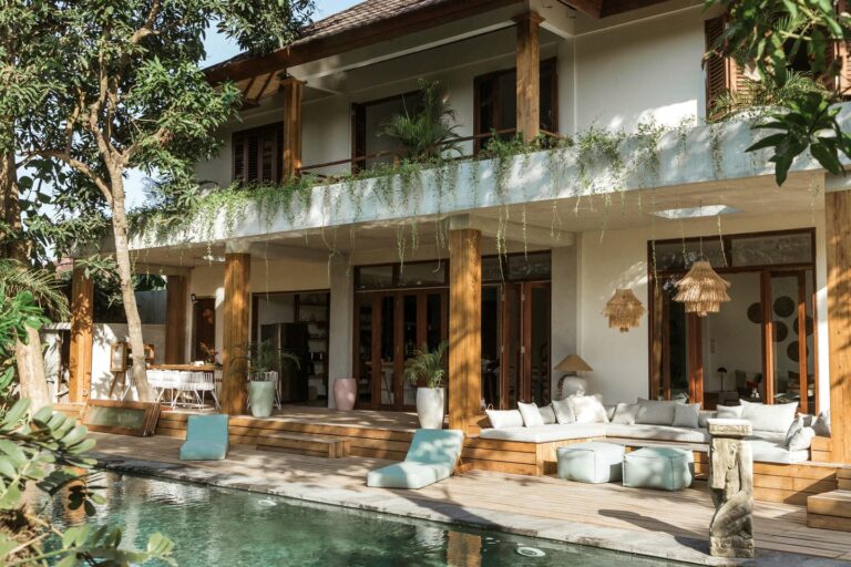 Modern tropical villa with pool and greenery