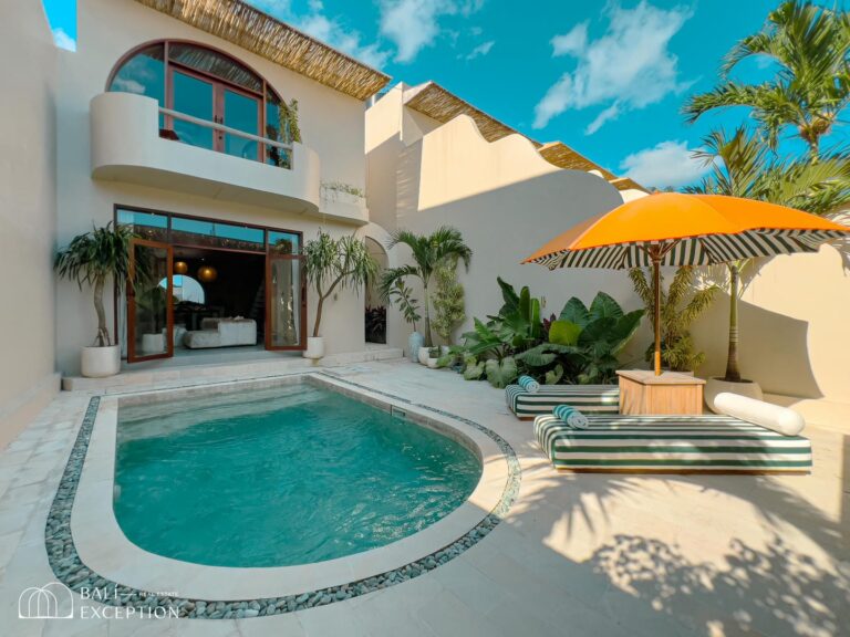 Luxury villa with pool and orange umbrella